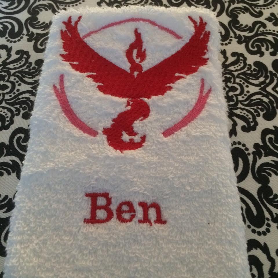 Embroidered towel with Pokemon go team Valor design