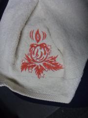 Embroidered on the towel burning candle free design