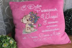 Embroidered pillow with bear and bouquet