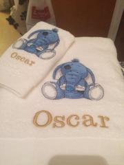 Embroidered towel with blue elephant design
