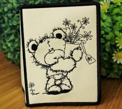 Embroidered picture of Teddy Bear with bouquet