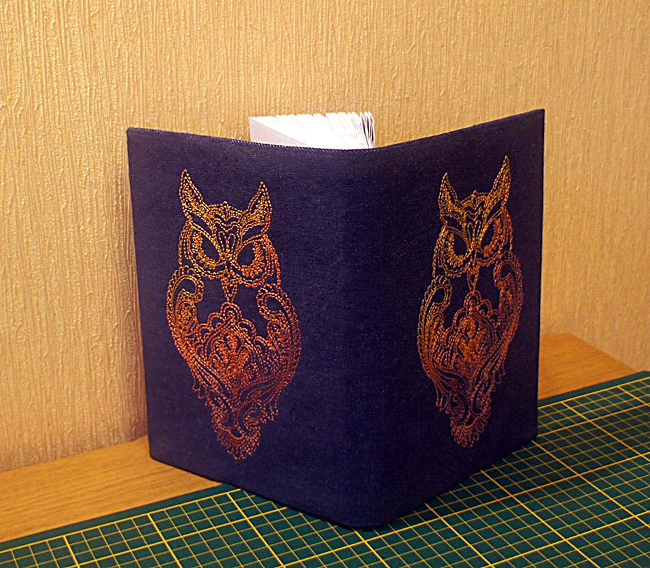 Embroidered on the cover of an owl machine embroidery design