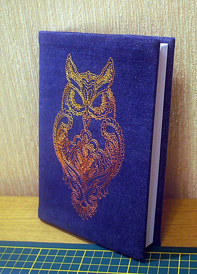 Strict owl on the book cover machine embroidery design