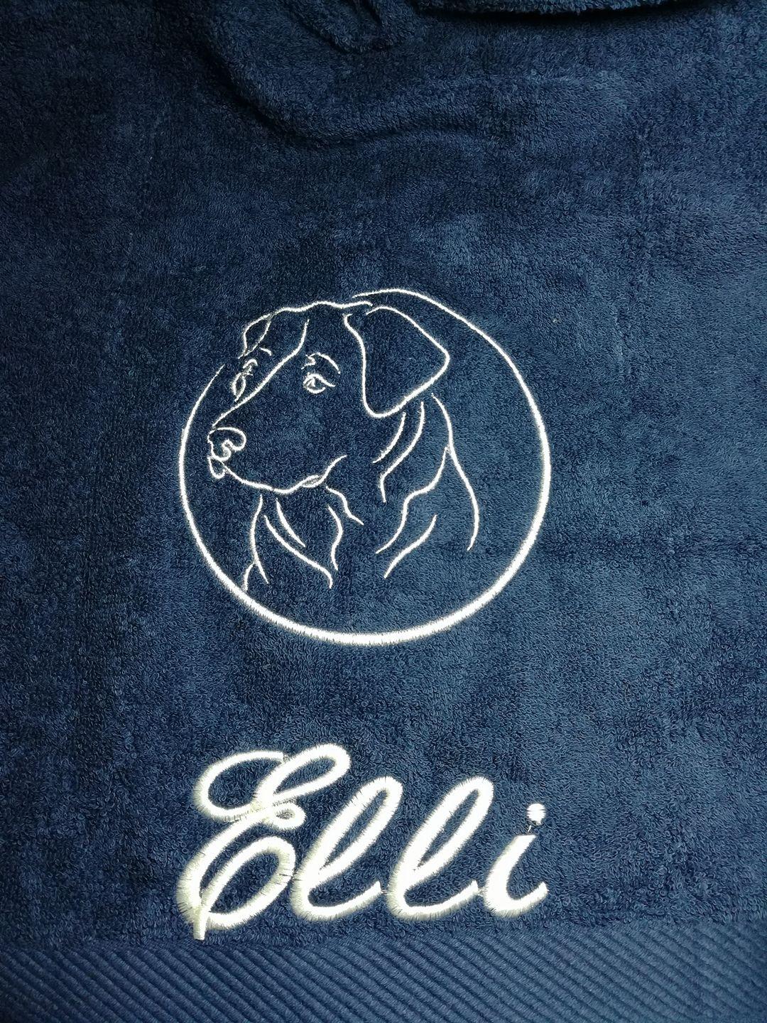 Embroidered towel with head of dog design