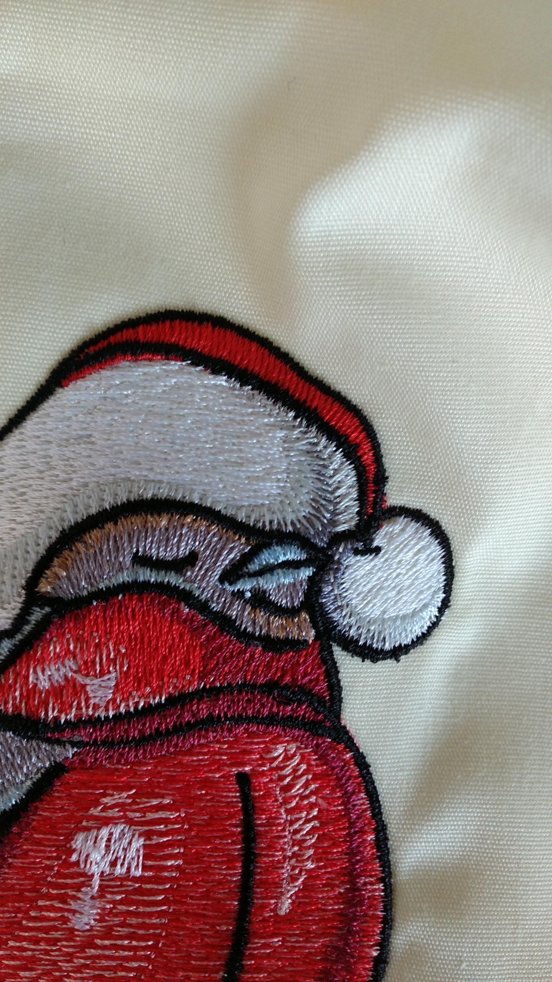 Fragment of red bullfinch embroidery design