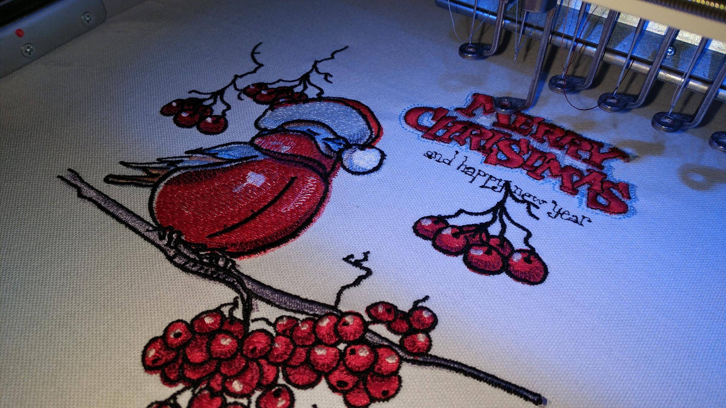 Making red bullfinch embroidery design