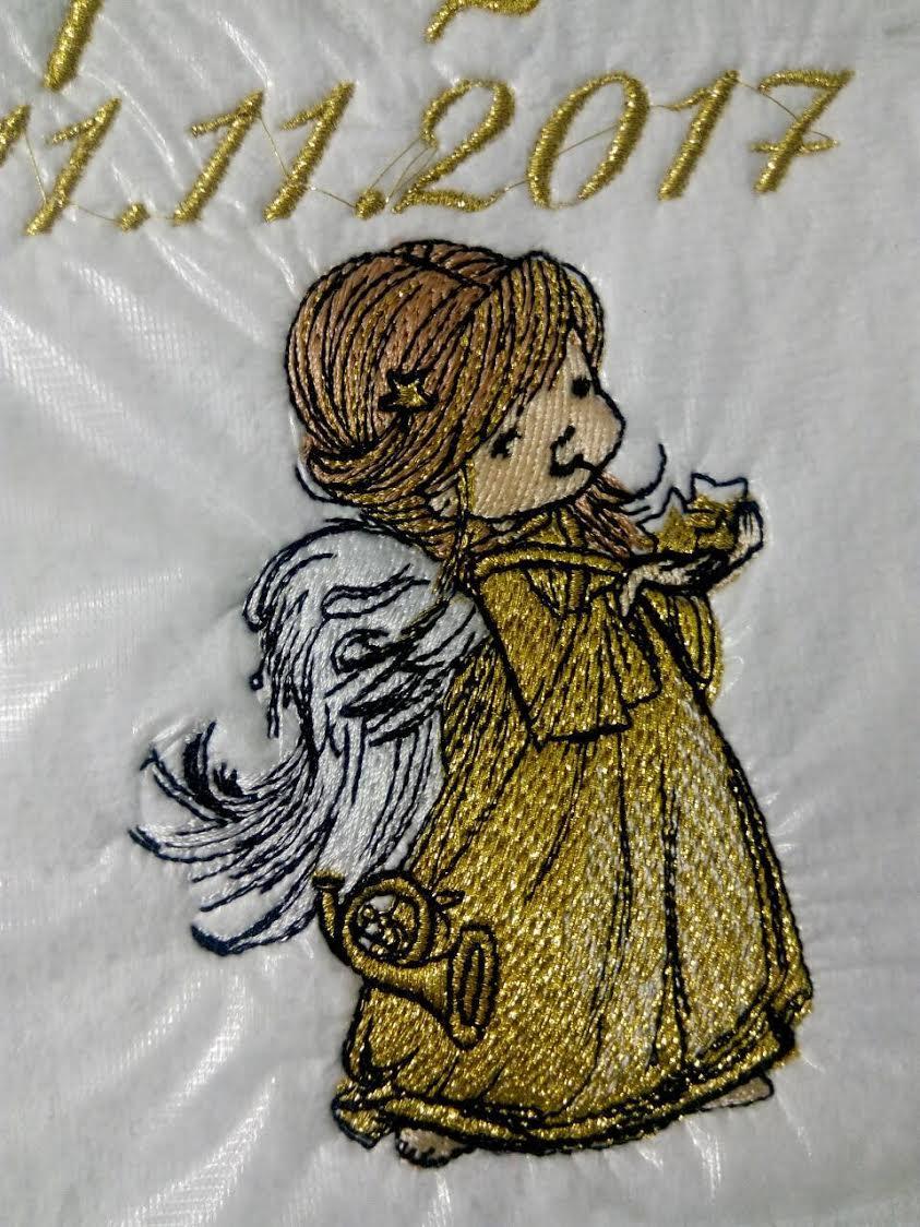 Close up golden angel embroidery design