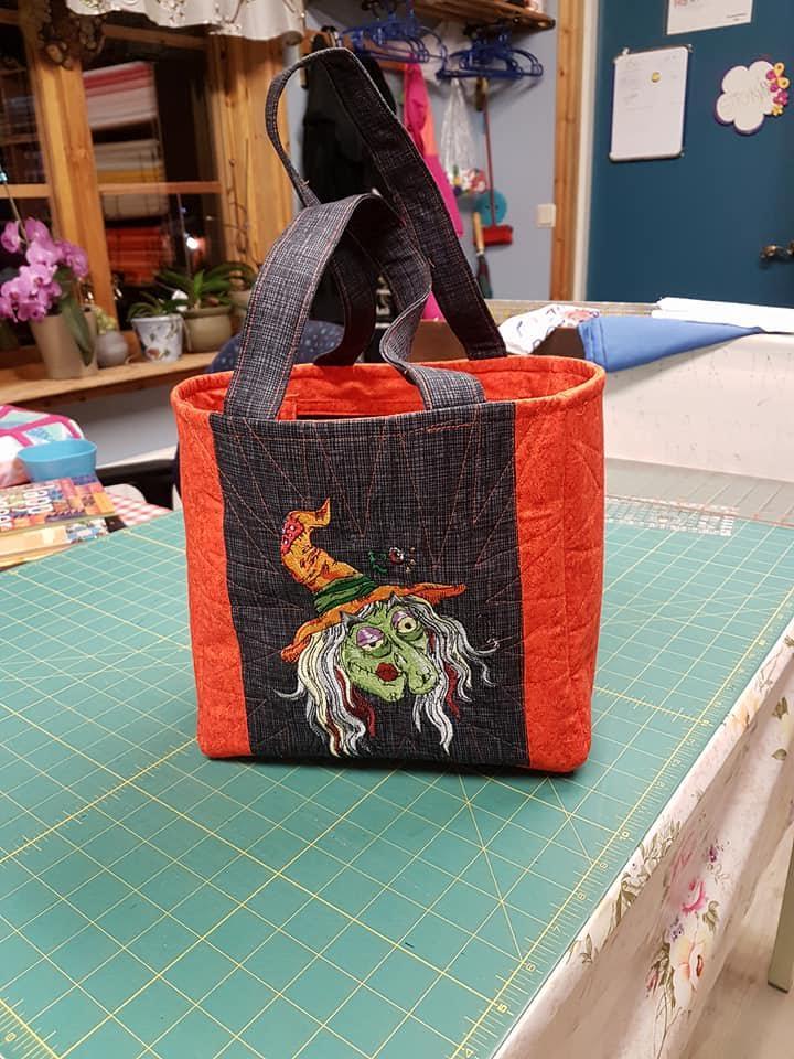 Whimsical A Colorful and bag with Ugly witch embroidery design