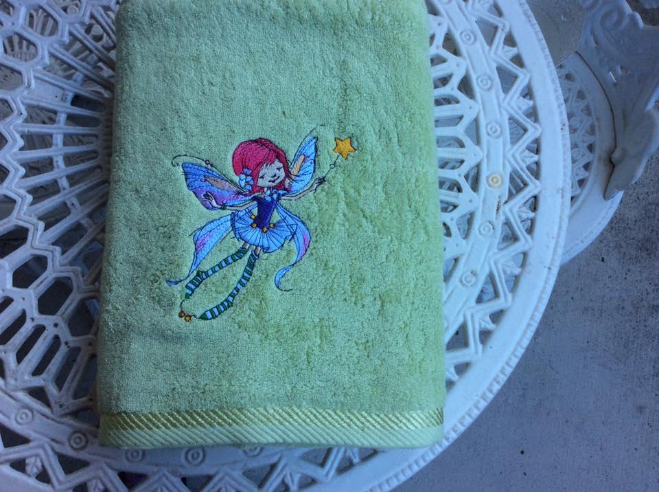 Embroidered towel with flying fairy design