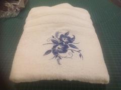 Embroidered towel with blue flower free design