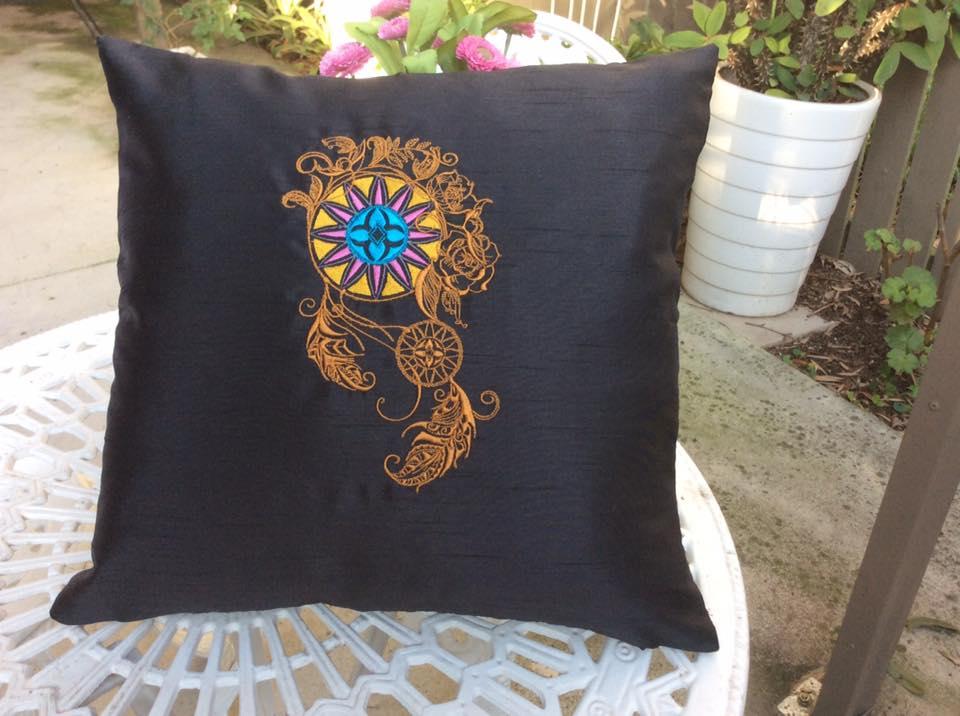 Embroidered cushion with Curvy dreamcatcher design