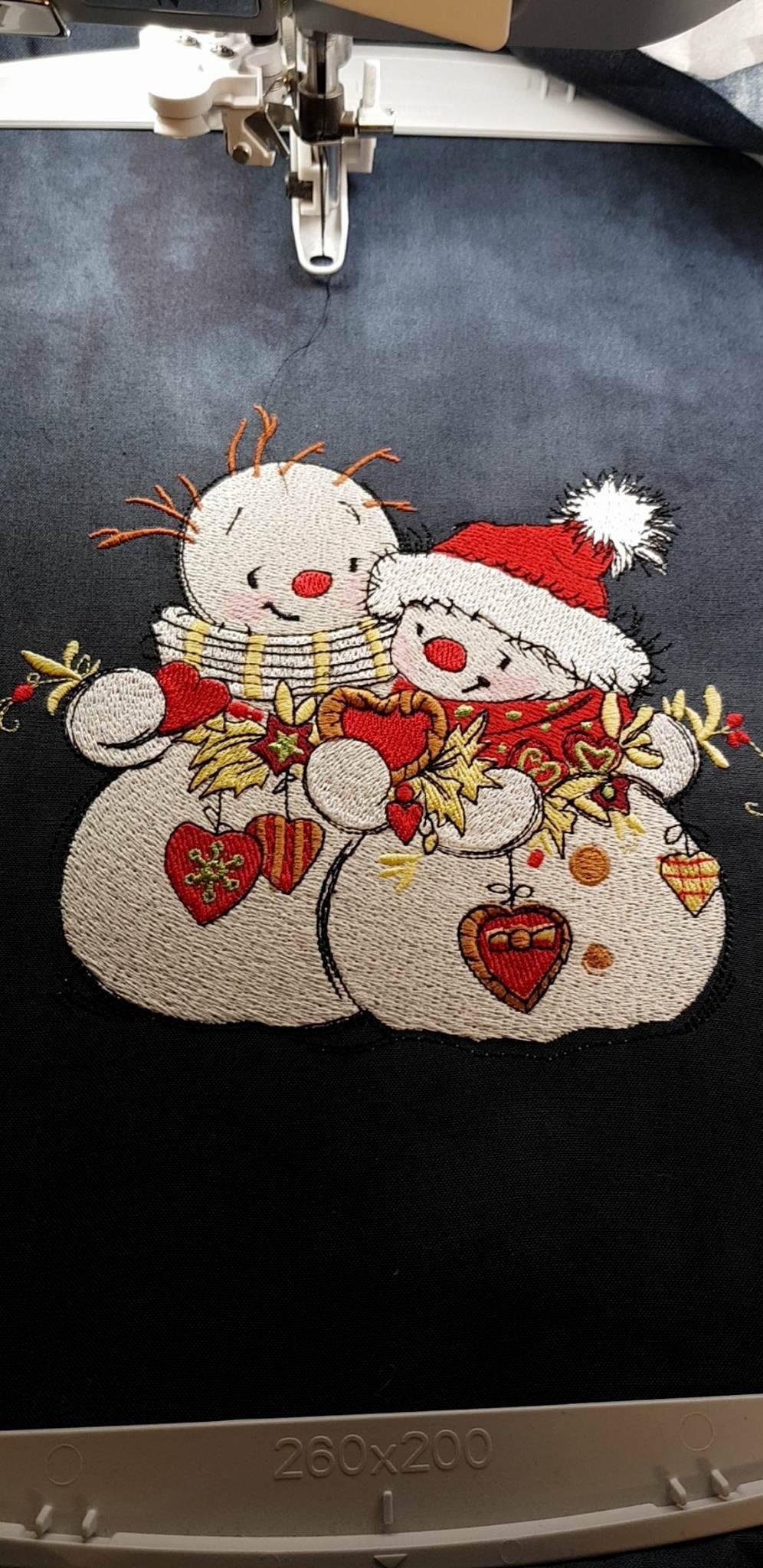Snowmen with Christmas toys embroidery design in progress