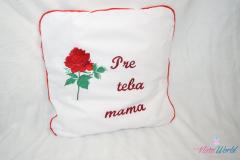 Embroidered cushion with red rose design