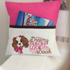 Embroidered pillow with spaniel puppy design