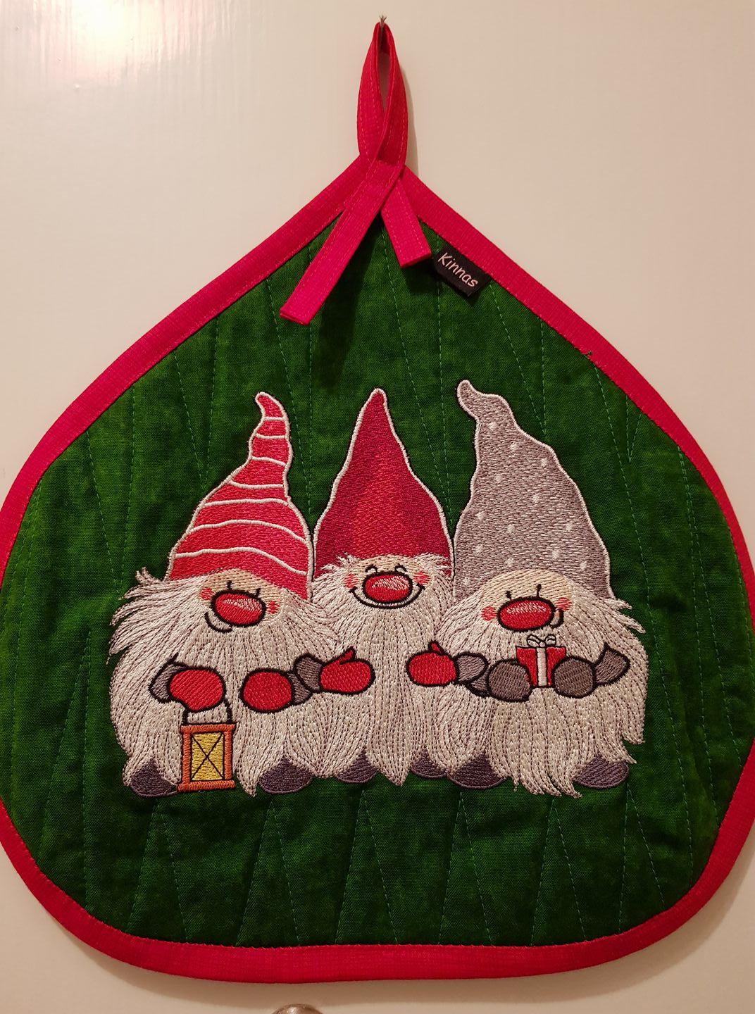 Embroidered potholder with Christmas dwarves design