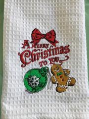 Embroidered towel with Christmas ball and gingerbread design