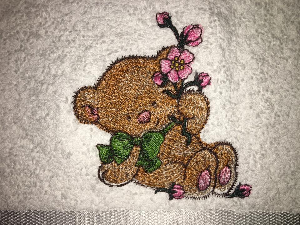 Bear keeping pink flower embroidery design