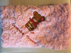 Embroidered baby item with Shy Teddy bear design