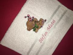 Embroidered towel with bear and pink flower design