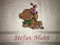 Embroidered towel bear keeping pink flower design