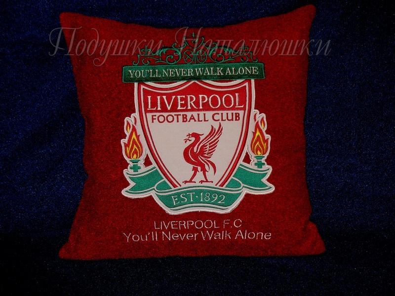 A pillow with a Liverpool FC logo