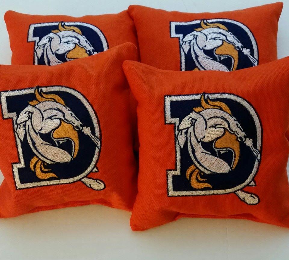 Embroidered pillow with Denver Broncoc logo design