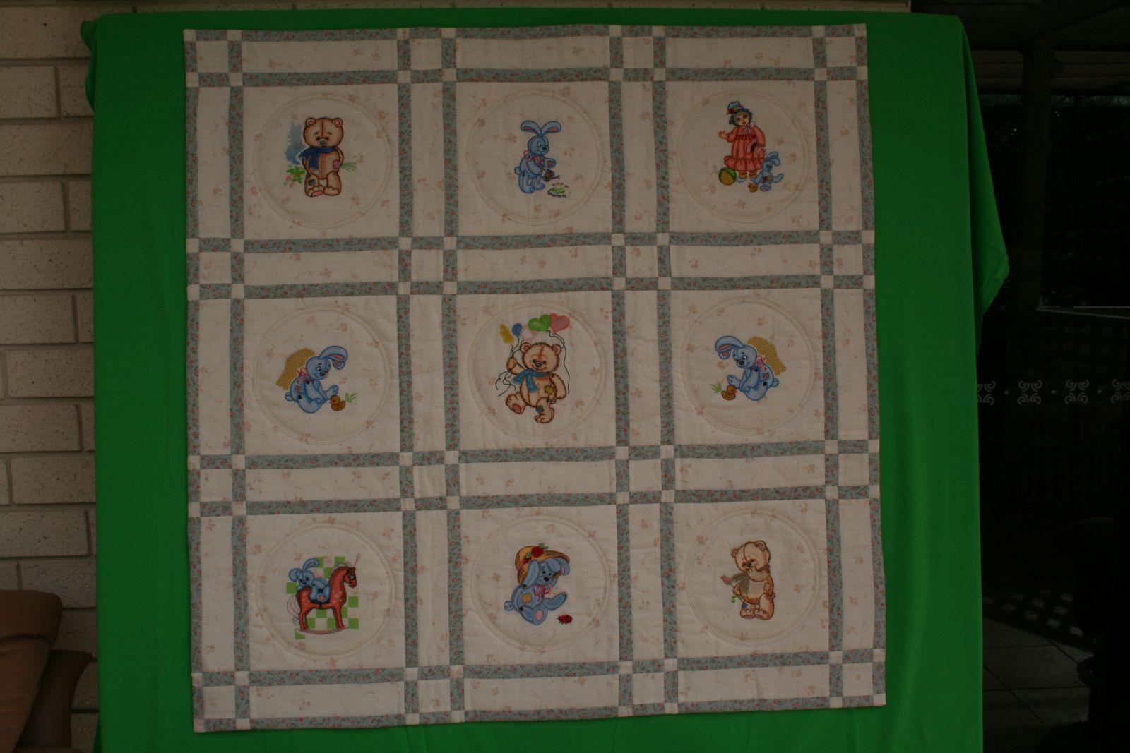 Quilt with teddy bear embroidery design