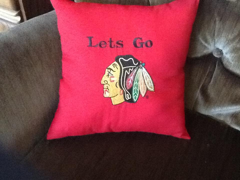 Embroidered pillow with blackhawk logo