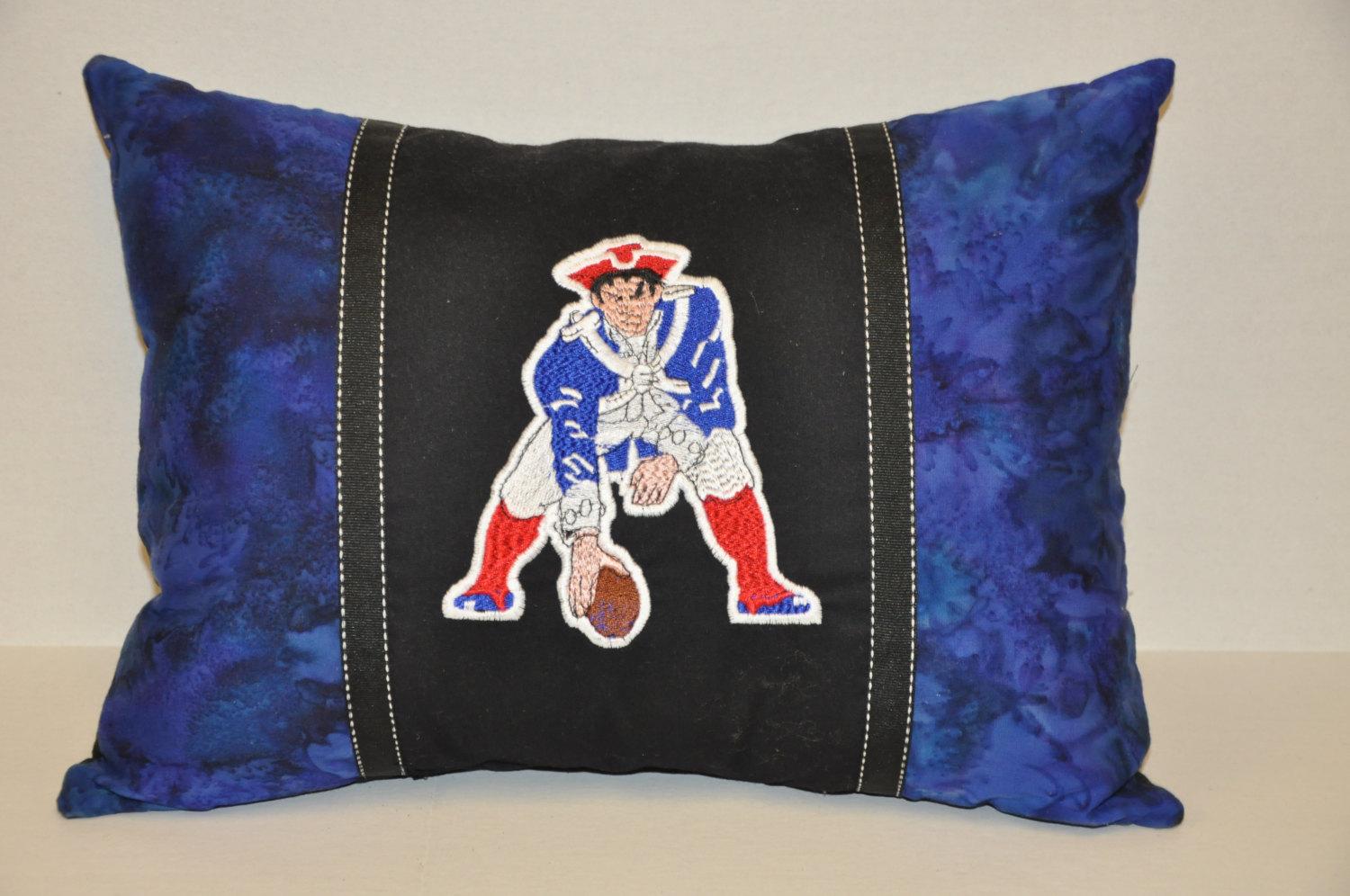 A pillow decorated with New England Patriots logo: detail