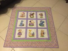 Embroidered quilt with old toys designs