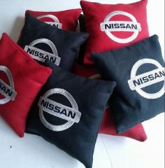 Nissan logo at embroidered pillow