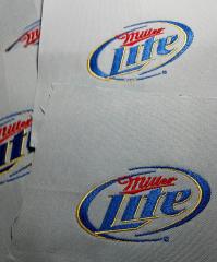 Embroidered pillow with Miller lite logo design