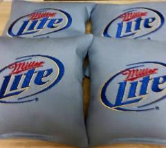 Pillow with Miller lite logo embroidery design