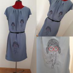 Embroidered dress with Reading girl design