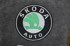 Pillow with a Skoda logo detail