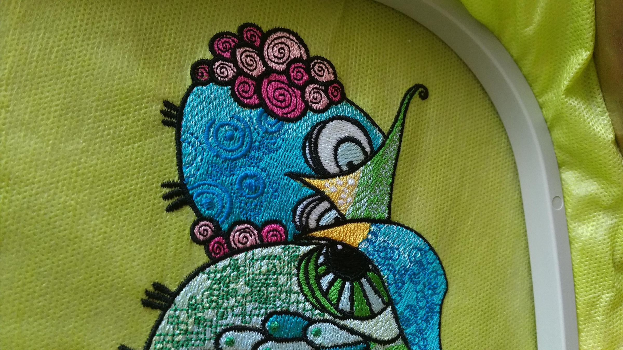 Fragment of grouсhy owls embroidery design