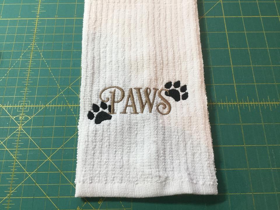 Embroidered kitchen towel with paws free design