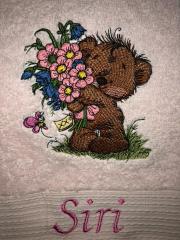 Fabric piece with Teddy bear with bouquet embroidery design