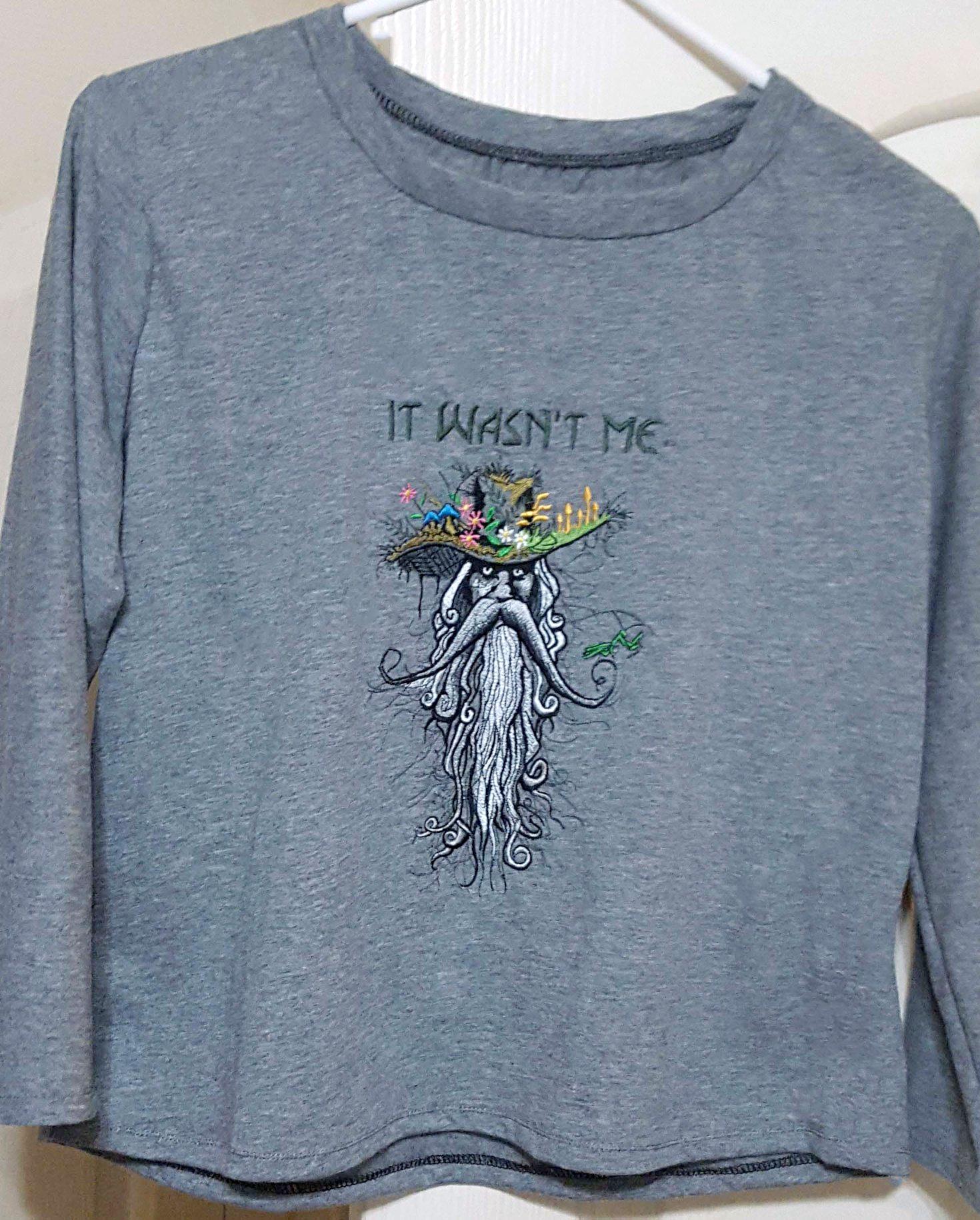 Embroidered sweater root man design