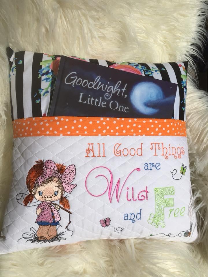 Embroidered cushion with fisher girl design