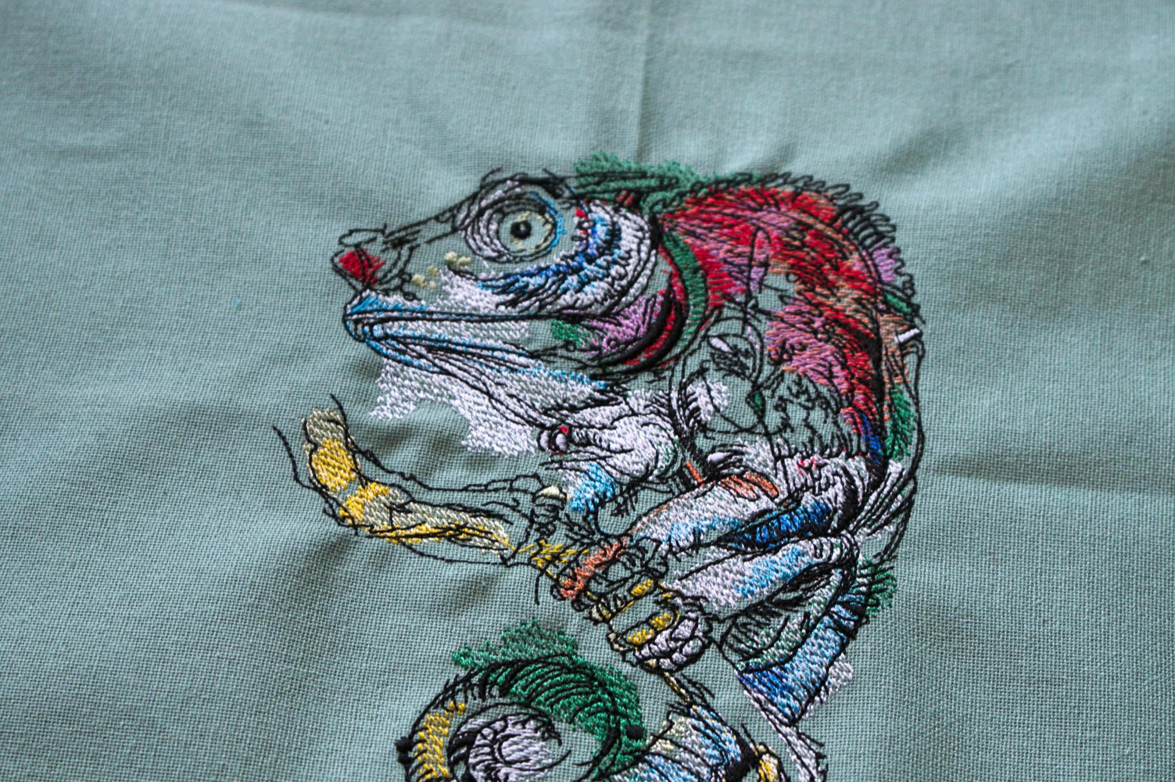 Lizard on tree branch embroidery design