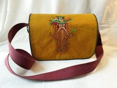 Embroidered bag with root man design