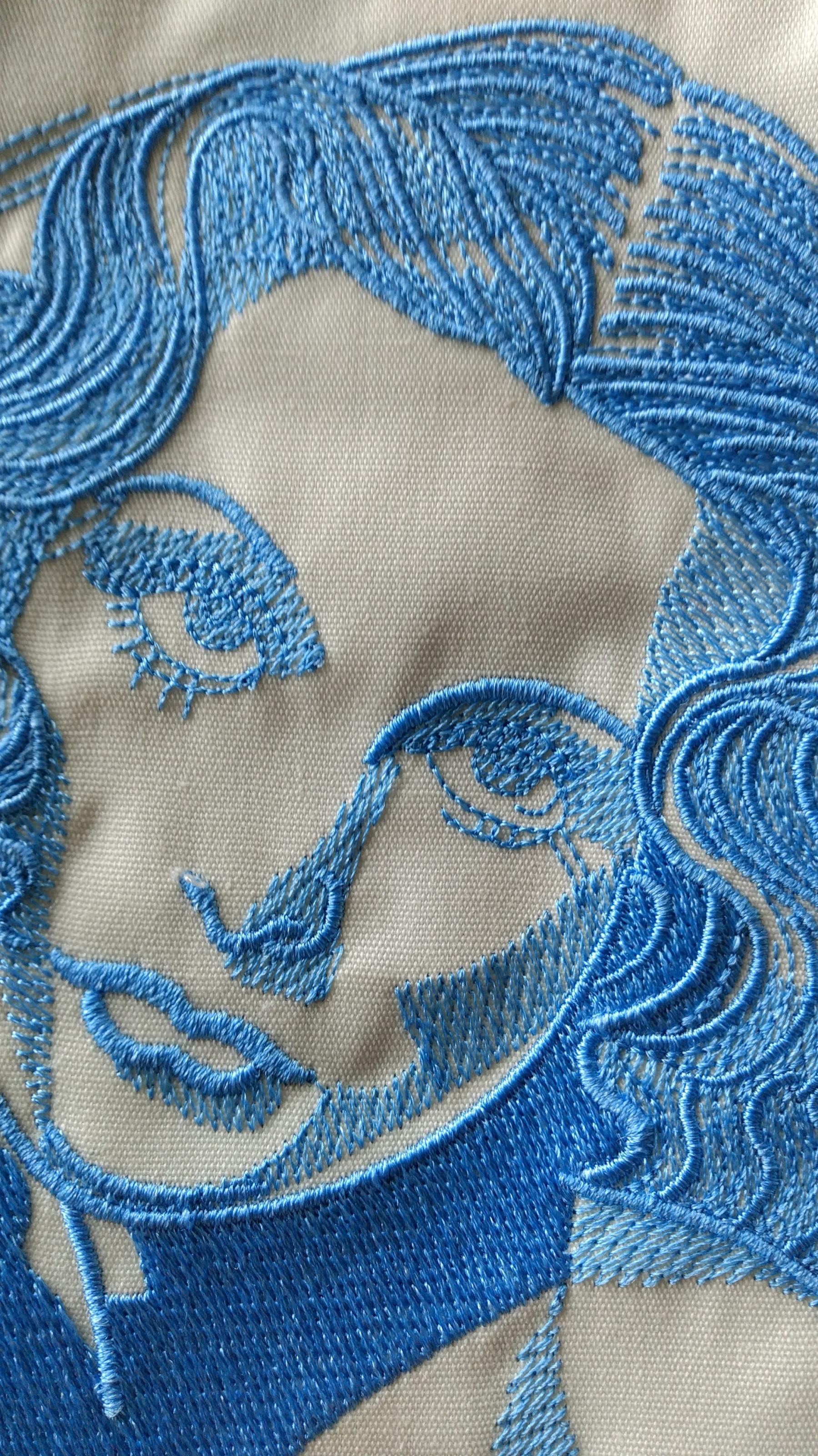 Face of woman with flower embroidery design