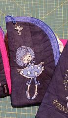 Embroidered case with girl in polka dot dress