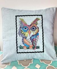 Embroidered cushion with colorful owl design