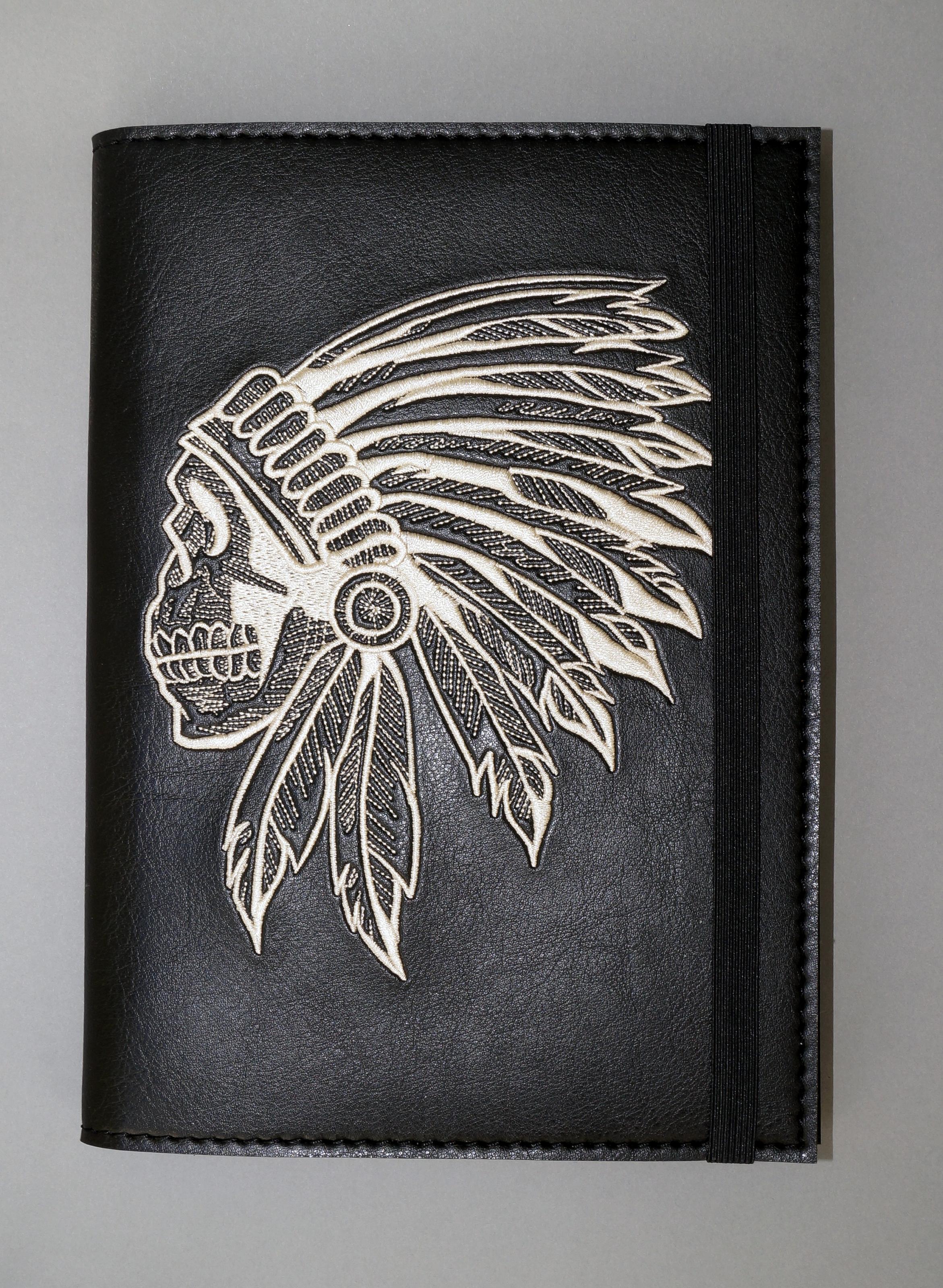 Embroidered leather cover with Indian skull design