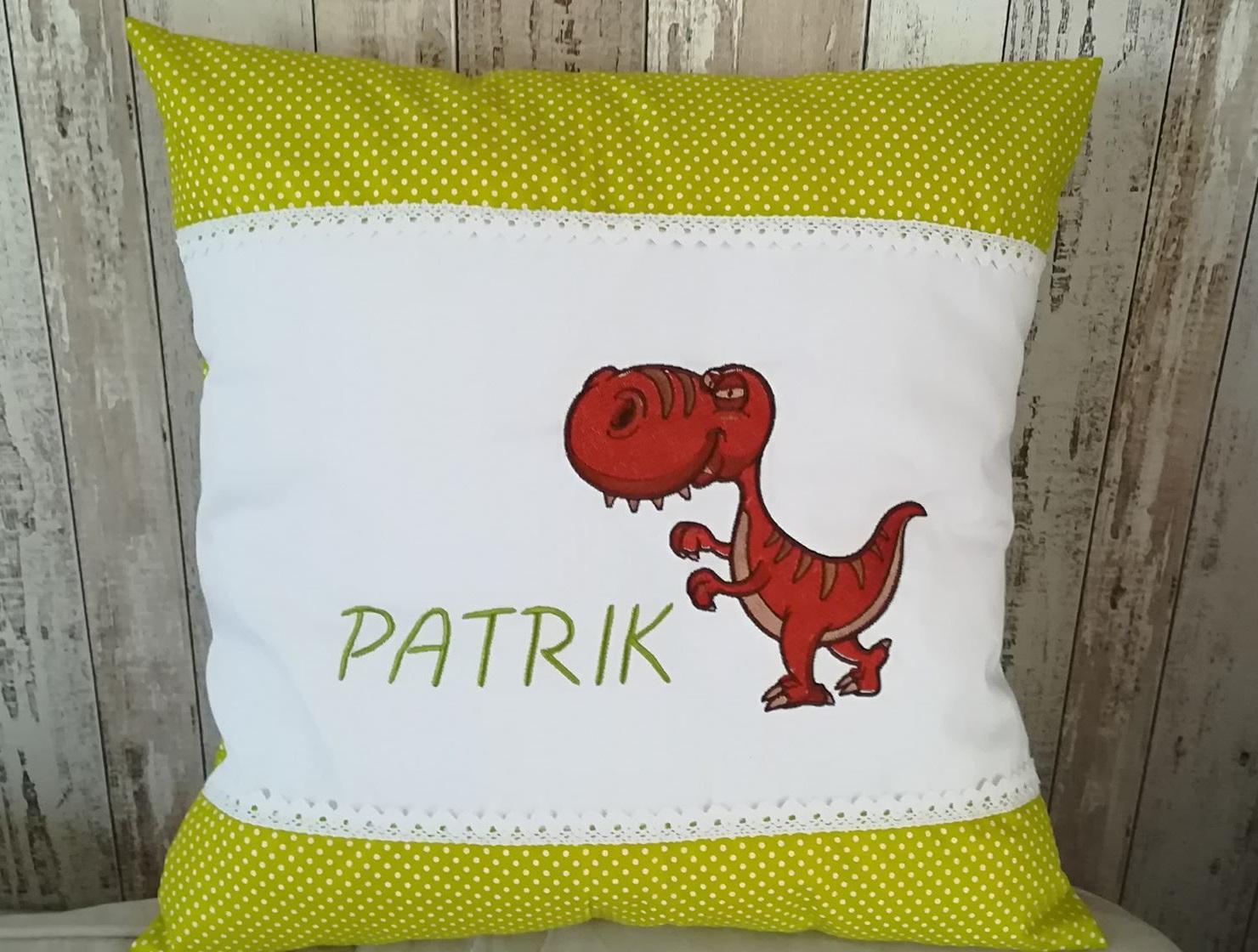 Embroidered cushion with Tiranosaur design