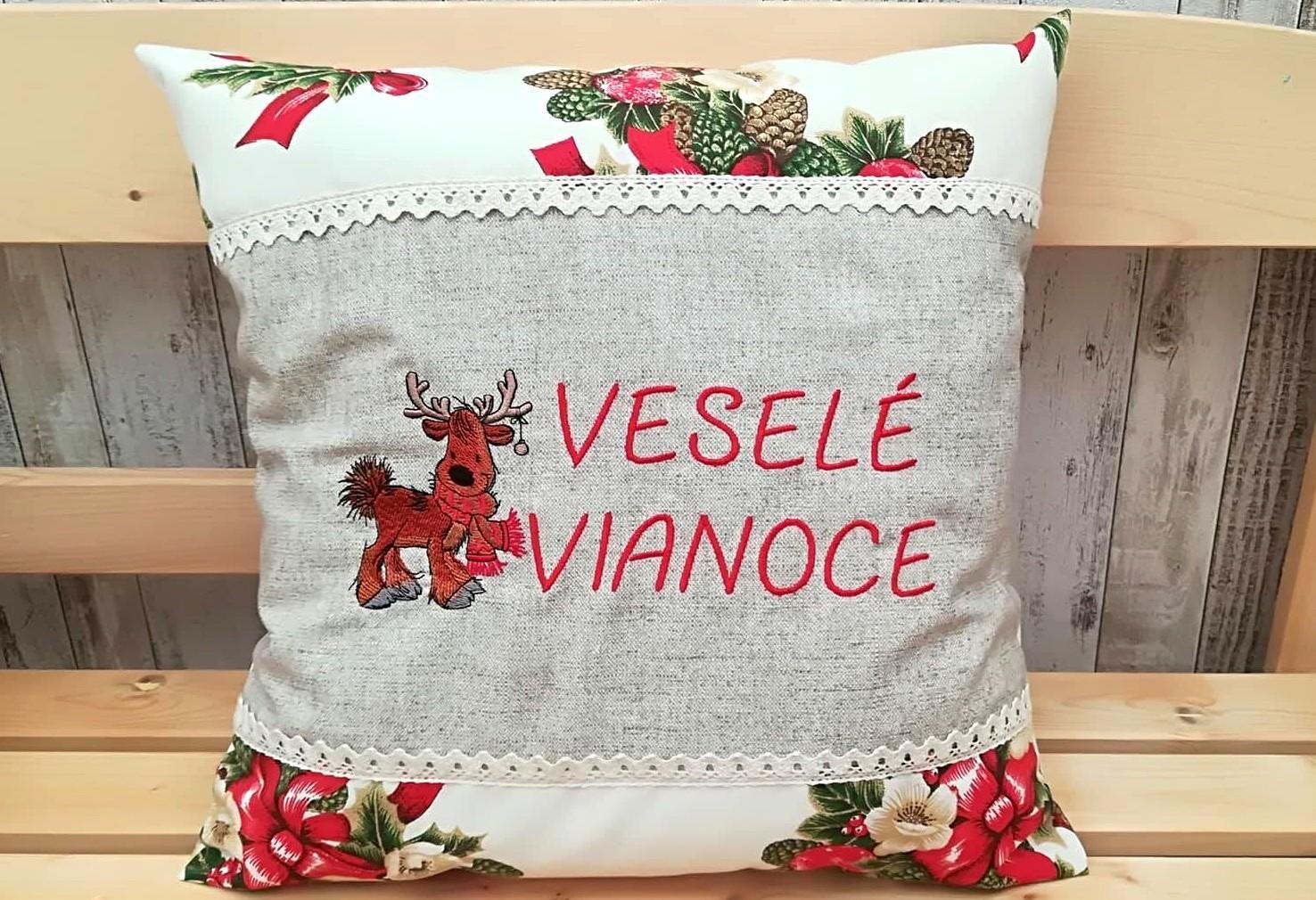 Embroidered cushion with Christmas deer design