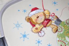 Teddy bear on Christmas ball design on hoop