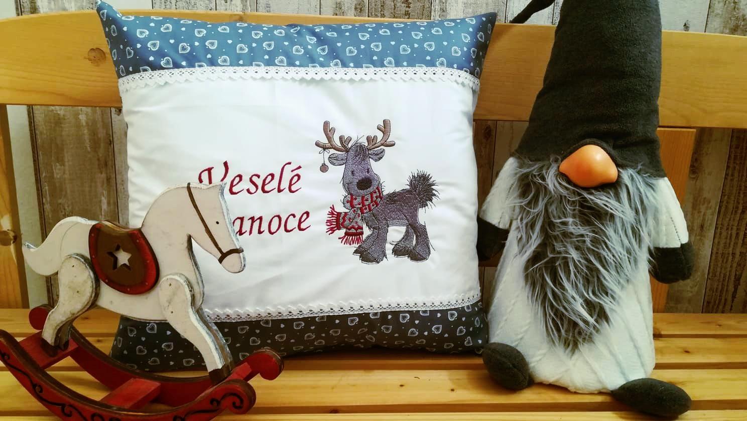 Embroidered cushion with Christmas deer design